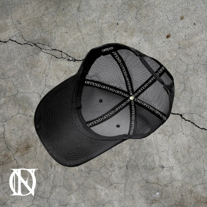 Black trucker cap with the OFFEND logo