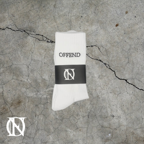 White socks with 'OFFEND' text