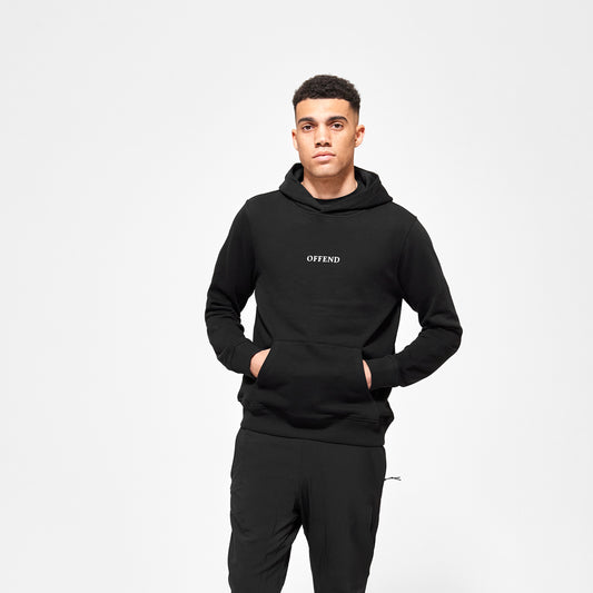 Model wearing Black 'OFFEND' hoodie with white 'OFFEND' text across the centre of chest on a white background