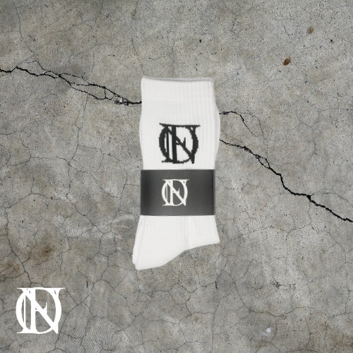 White socks with the OFFEND logo