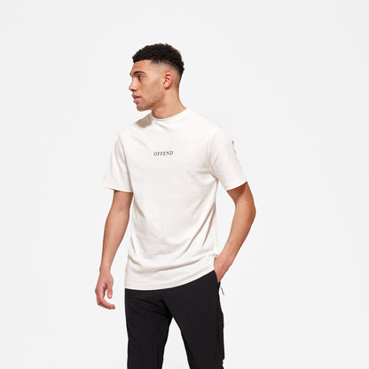 Model wearing 'OFFEND' white T shot from the front with 'OFFEND' text across the centre of chest 