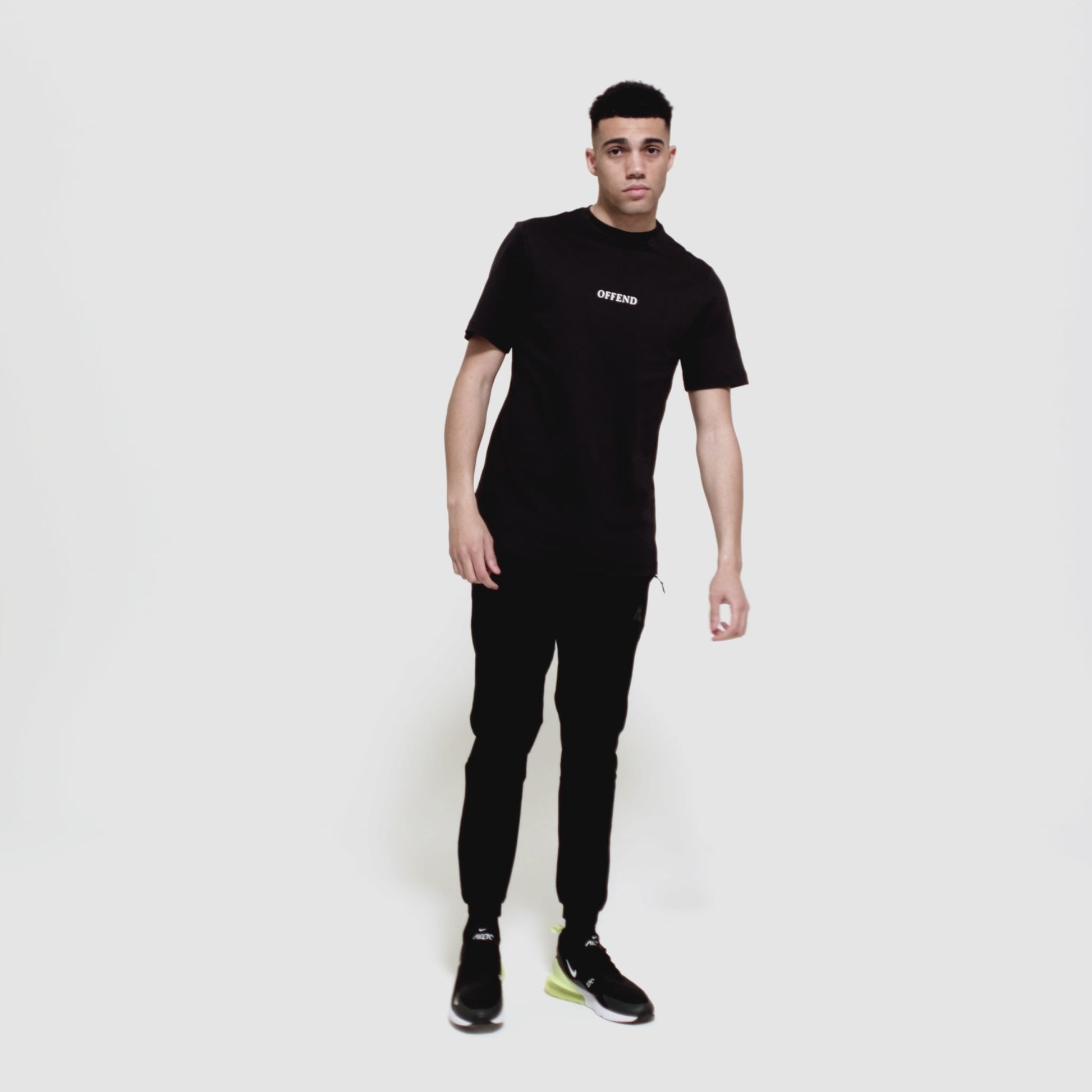 Model wearing 0G 'OFFEND' black T-Shirt moving around showcasing the front and back of the T-shirt as well as close up shots on a white background