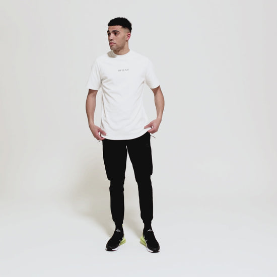 Model wearing 0G 'OFFEND' white T-Shirt moving around showcasing the front and back of the T-shirt as well as close up shots on a white background